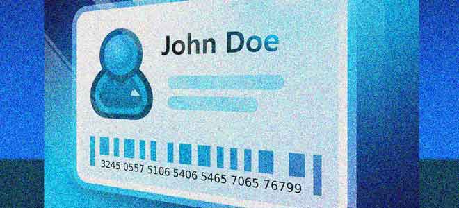 Photo of a 'John Doe' identity card next to a credit card on a blue surface.